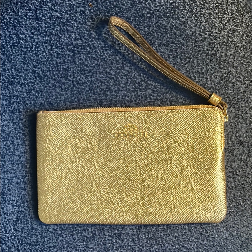 Metallic gold Coach wristlet